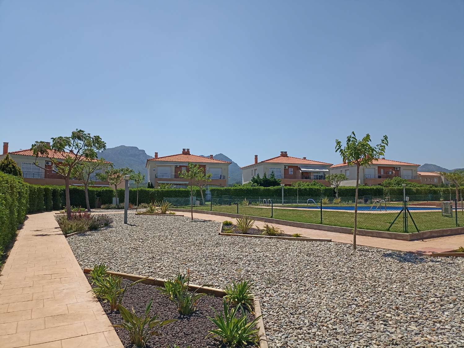 First floor apartment with garden and communal pool